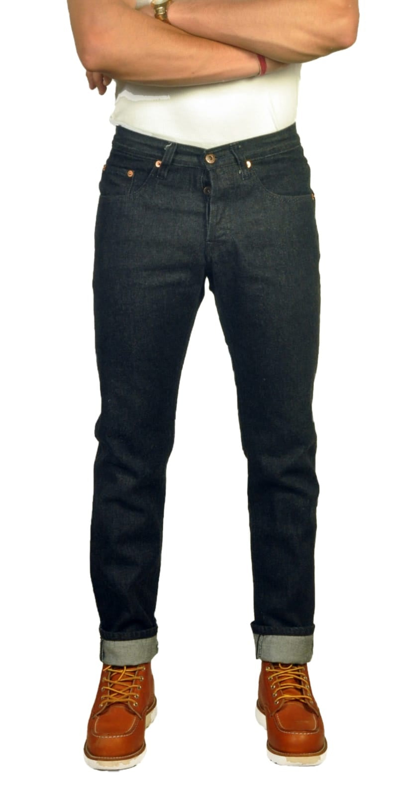 Person wearing 13 oz japanese denim jeans and brown boots on a white background