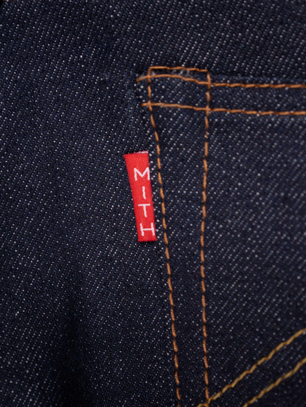 13 oz Japanese Selvedge Raw Denim Jeans-Close-up of a red label with 'MITH'