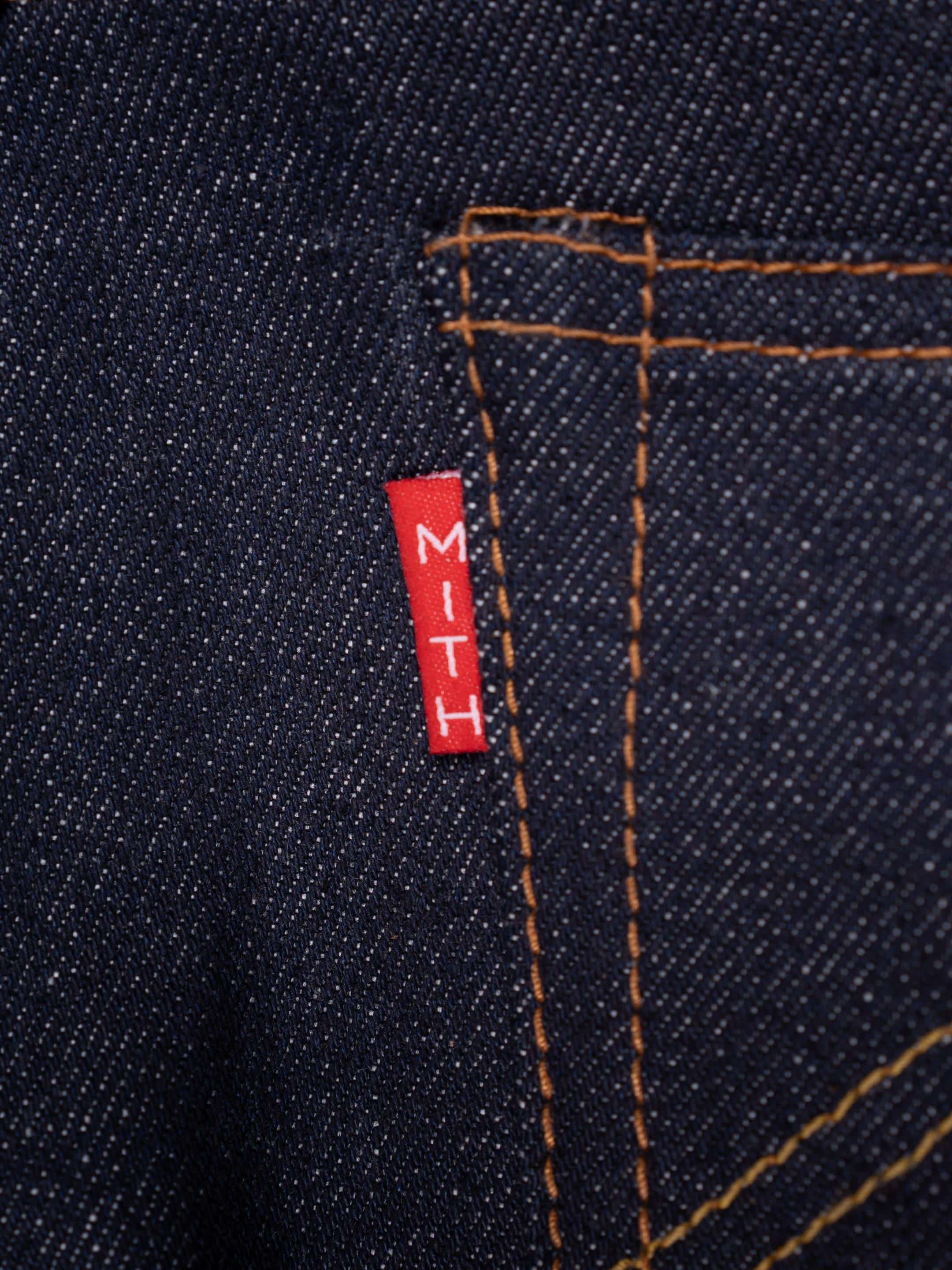 13 oz Japanese Selvedge Raw Denim Jeans-Close-up of a red label with 'MITH'
