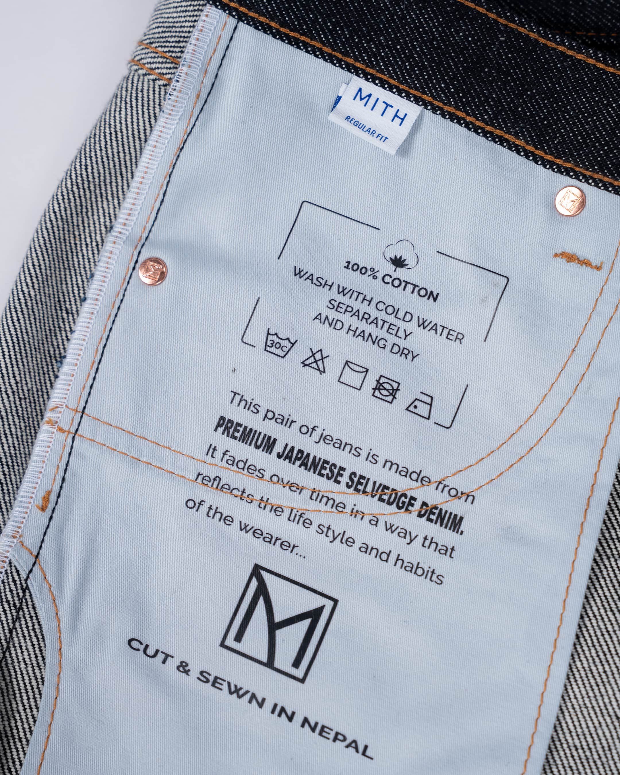 Close up cotton pocket bag with wash instructions and product description
